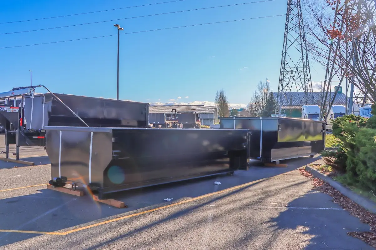 Roll-off dumpster ready for waste disposal at job site for Demolition Dumpster Rental in Hampstead